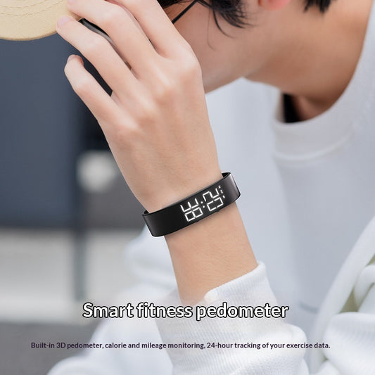 Black LED alarm bracelet worn on the wrist